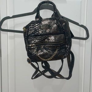 BCBG mini backpack. Faux snake skin. Bronze